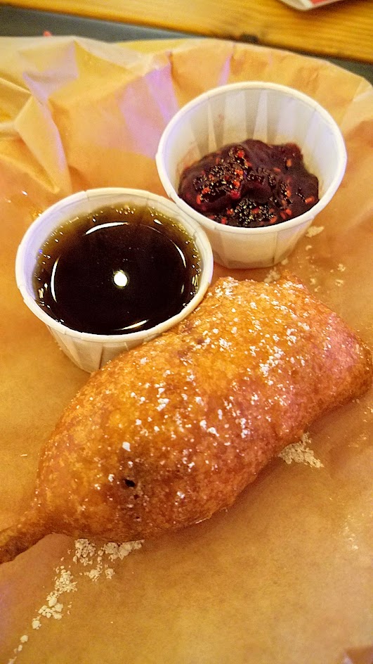 Brunch at Pine Street Market includes OP Wurst with their four breakfast hot dogs, such as this Monte Cristo On A Stick with Maple syrup, raspberry jam