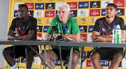 Bafana Bafana coach Hugo Broos with players Siyanda Xulu, left, and Luke le Roux, right, during a press conference at Dobsonville Stadium on September 19 2022.