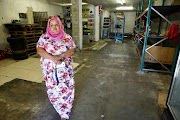 Delft shop owner Aisha Domingo managed to clear her cash-and-carry store of stock before looters reached it.