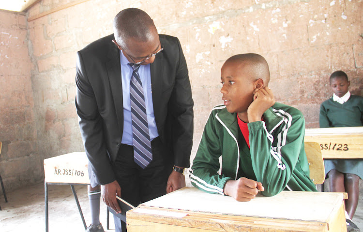 KNEC CEO David Njeng'ere at Athi River Primary School in Mavoko, Machakos County on Friday.