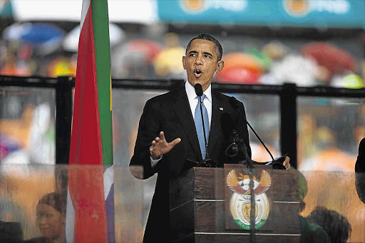 INSPIRED: US President Barack Obama pays tribute to Nelson Mandela yesterday Picture: