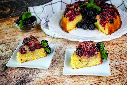 Slices of Vanilla Blackberry Cake on plates.