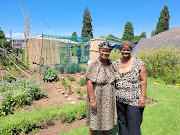 Khoisan queen Cynthia and her sister, Sarah Kleintjies, in front of their vegetable garden at the Union Buildings.