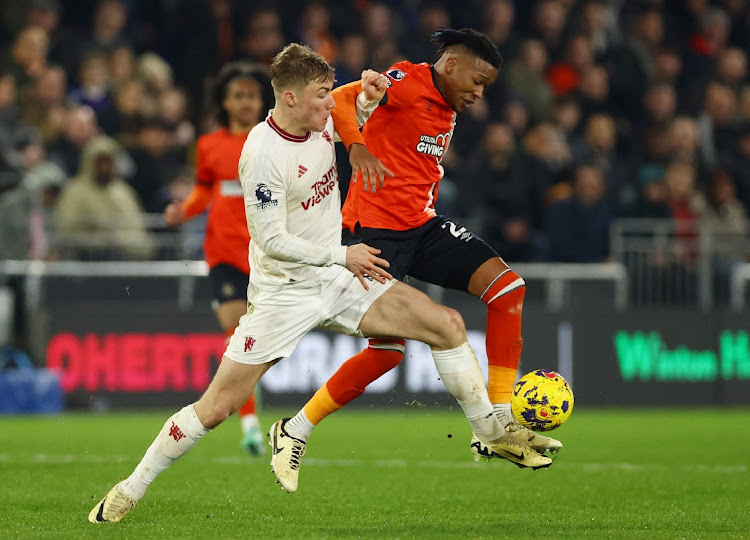 Manchester United's Rasmus Hojlund in action with Luton Town's Gabriel Osho Soccer at Kenilworth Road, Luton, Britain, February 18 2024 Picture: HANNAH MCKAY/REUTERS