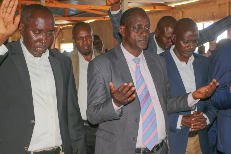 Governor Joseph Lenku, on the left, during a special church service led by Archbishop Peter Tankua of the Presbyterian Central Mission of Africa in Sajiloni, Kajiado Central, on Sunday.