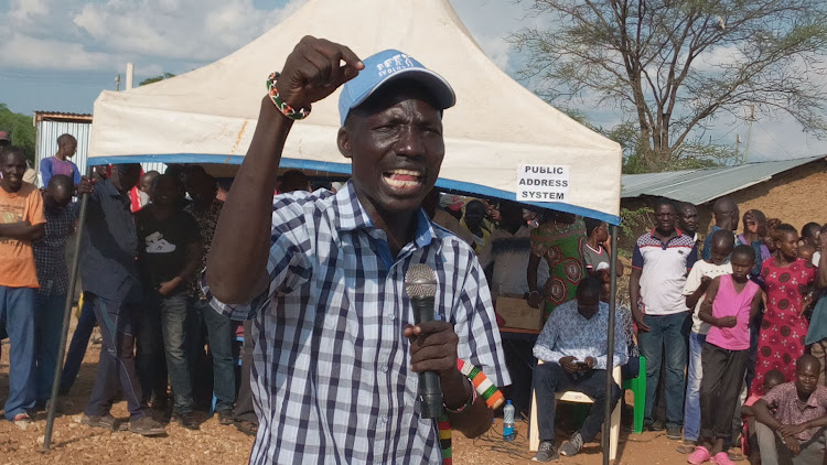 Turkana South MP James Lomenen addresses residents of Kainuk in Turkana south on Saturday.