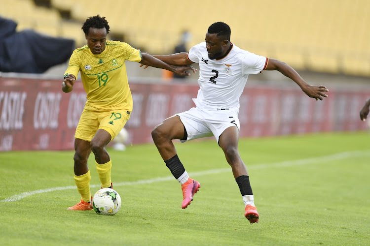 Percy Tau of South Africa and Tandi Mwape of Zambia during the friendly at Royal Bafokeng Stadium on October 11, 2020