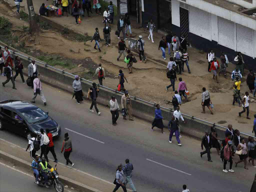 Commuters walk to the CBD on January 3 following the ban on matatus from the CBD. /MONICA MWANGI