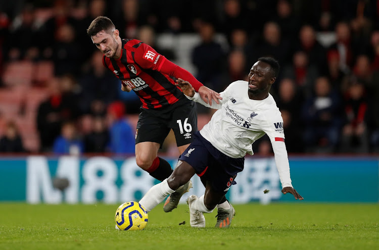 Bournemouth's Lewis Cook in action with Liverpool's Naby Keita