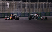 Max Verstappen and Lewis Hamilton collide during the F1 Grand Prix of Saudi Arabia at Jeddah Corniche Circuit on December 05, 2021 in Jeddah, Saudi Arabia. 