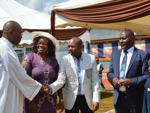 From Left) father Joseph Muroki, kiambu county women representative seat aspirant Gathoni Wa Muchomba with her husband Robert Mbugua and Church development chairman Tom Kimari during fundraising of building our lady of Fatima catholic church in Ndumberi in Kiambu on Sunday.