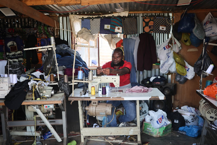 Patrick Adam is a tailor in Emandleni, Wattville. He says he hasn't heard of anyone being sick but he follows the advice of nurses who visited the area. Picture: Alaister Russell