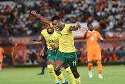 Bafana Bafana's Themba Zwane celebrates his goal with teammate Lebo Mothiba in their international friendly agianst Ivory Coast at Stade Felix Houphouet Boigny in Abidjan, Ivory Coast on Tuesday night.