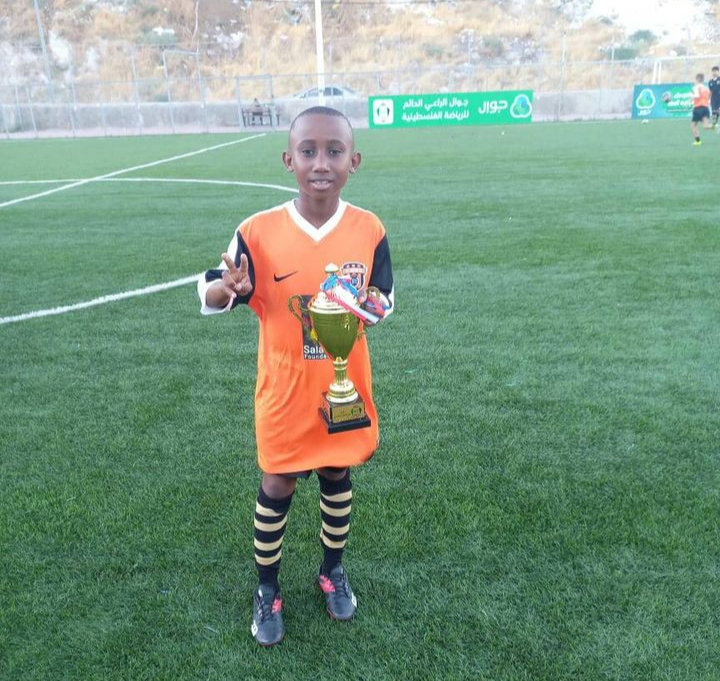 Kabelo Masalesa with a trophy after his game on Saturday. The SA team is said to have won 2-1 against the Palestinian team.