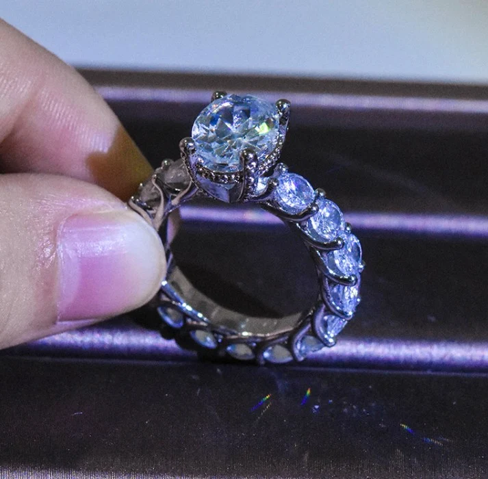 Title 3, Full Diamond Four Claw Mosang Stone Ring. A tim...