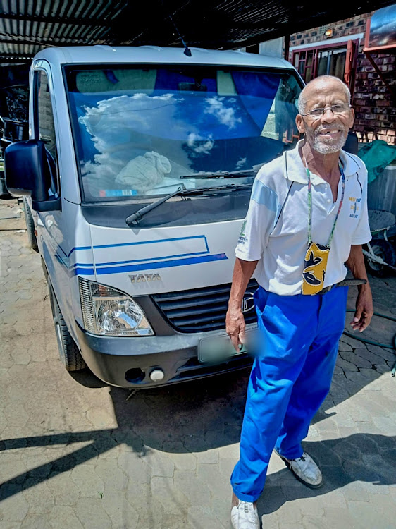 Thomas Themba stands next to his Tata Super Ace which he was robbed in eight months ago. He is all smiles after nabbing one of the two gunmen last week.