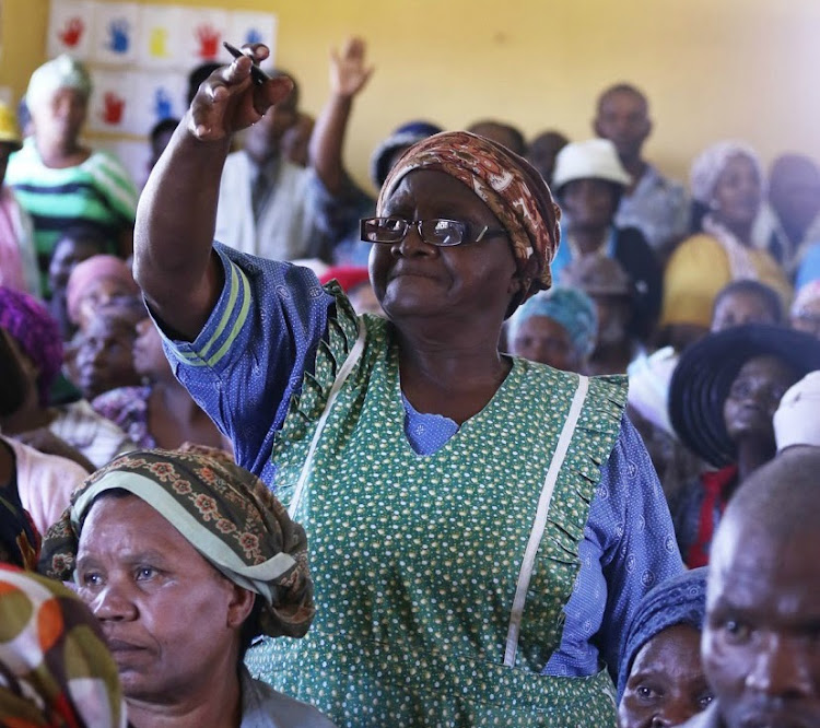 Nobakhe Mila speaks at a land claim meeting in Upper Mngqesha, KZN.