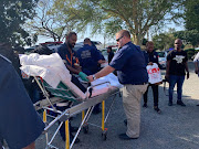 A teacher receiving medical treatment after inhaling an unknown gas at a school in Umlazi on Monday.