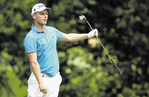 DARK HORSE: Unheralded Dane Morten Orum Madsen, the surprise winner of the South African Open yesterday, watches his shot during yesterday's final round at the Glendower Golf Club. The Dane won the title by two shots Picture: