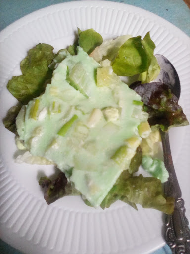 A portion on a bed of lettuce. 