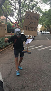 Protestor outside the Gupta residence in Saxonwold