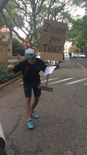 Protestor outside the Gupta residence in Saxonwold