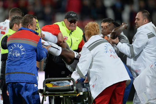 Cameroonian international Patrick Ekeng is lifted from the pitch to be transported to a hospital after he collapsed during football match between Romanian Dinamo Bucharest and Viitorul Constanta in Bucharest on May 6, 2016. The 26-year-old midfielder was confirmed dead two hours upon arriving at the hospital.