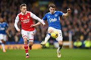  Seamus Coleman of Everton battles for possession with Leandro Trossard of Arsenal during the Premier League match between Everton FC and Arsenal FC at Goodison Park.