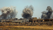 Smoke rises from al-Harak town, as seen from Deraa countryside, Syria on June 25, 2018. 