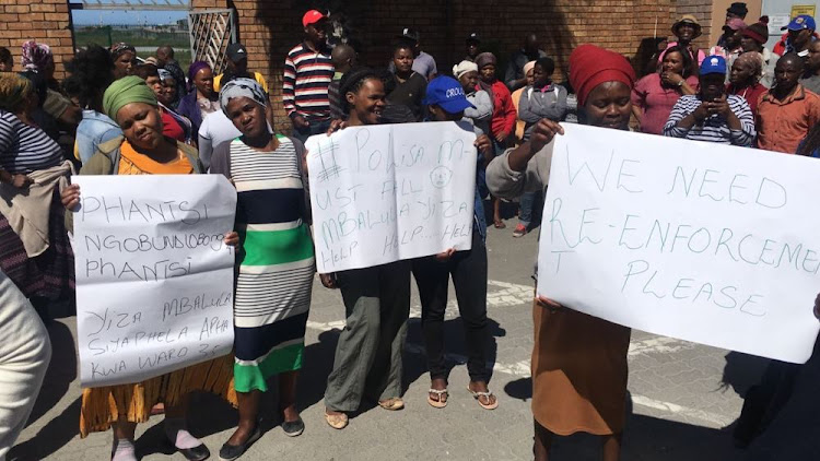 Marikana residents protest on Saturday outside Philippi East police station after 11 murders in the community on Friday night.