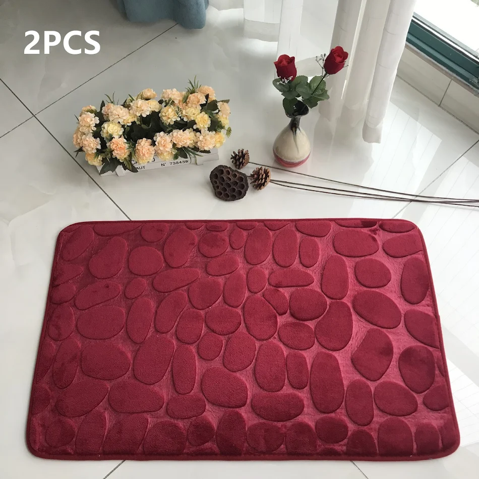 Alfombra de suelo absorbente de piedra antideslizante con relieve, ideal para baños y cocinas. Secado rápido, segura y elegante.