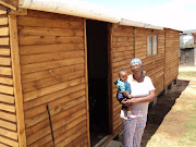 Gloria Matebe, who lives in an informal settlement in Oudtshoorn, collected her own wood and built herself a Wendy house.