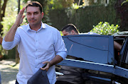 Flavio Bolsonaro, son of president-elect Jair Bolsonaro, salutes as he arrives to record an electoral programme for television in Rio de Janeiro, Brazil, October 23 2018. 