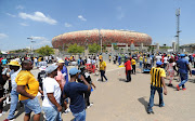 A file photo of football loving fans arriving at the stadium during the Absa Premiership match between Orlando Pirates and Kaizer Chiefs at FNB Stadium.