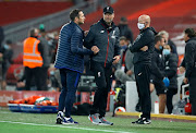 Frank Lampard, Manager of Chelsea and Jurgen Klopp, Manager of Liverpool embrace following during the Premier League match between Liverpool FC and Chelsea FC at Anfield on July 22, 2020 in Liverpool, England. 