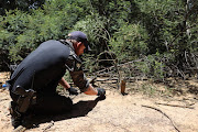 Members of the community policing forum attempt to track a tiger on January 16 2023, in Walkerville, south of Johannesburg, where a fully grown female tiger escaped on Friday evening.