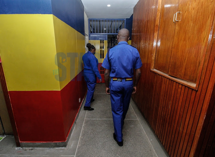 Police officers based at the Milimani law Courts walks along the Corridors of the newly set Judiciary Police Unit at the former Forodha house on September 13,2021.