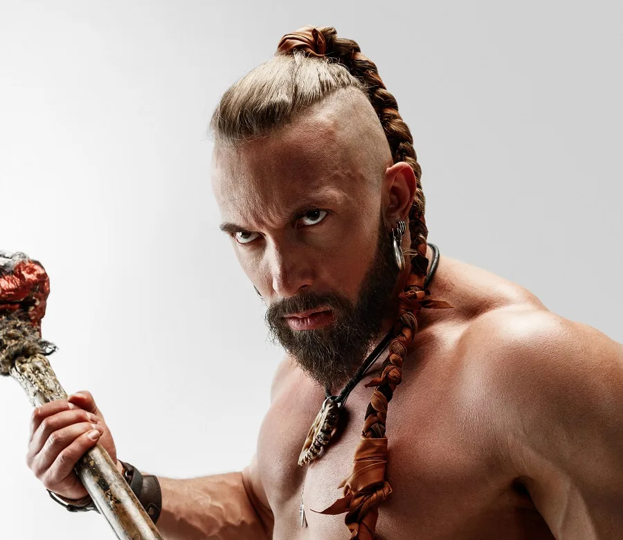 Full  portrait of a guy rocking a ponytail showing off his viking look