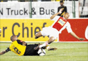 CLASH OF EQUALS: Kaizer Chiefs defender Jimmy Tau tackles Ajax Cpae Town's Granwald Scott in their Premiership clash at Loftus Stadium in Pretoria on Saturday night. Pic. Chris Ricco. 27/09/08. © Backpagepix.