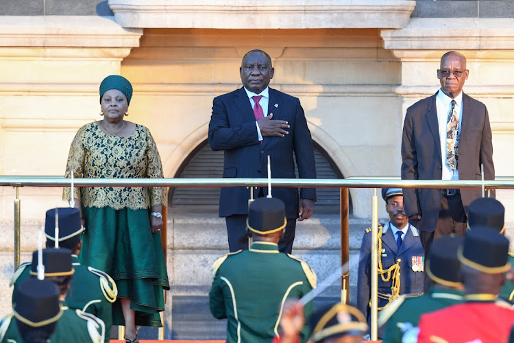 President Cyril Ramaphosa gestures while standing next to National Assembly speaker Nosiviwe Mapisa-Nqakula ahead of the state of the nation address at the Cape Town City Hall on February 8 2024.