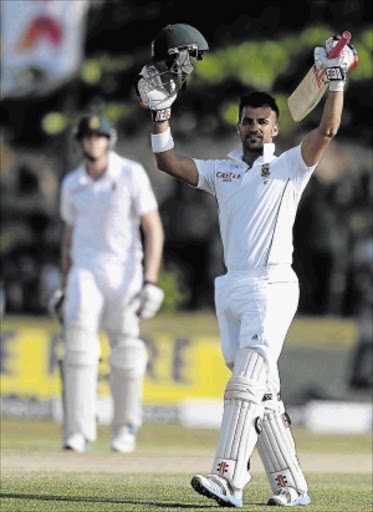 FORT DUMINY: Proteas batsman JP Duminy raises his bat and helmet in celebration after scoring 100 during the second day of the opening test match against Sri Lanka at the Galle International Cricket Stadium yesterday Photo: LAKRUWAN WANNIARACHCHI/AFP