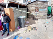 The shallow grave where community members reportedly found Stacey Adams’ body on Sunday‚ just across the road from her family home. Next to the grave is the Wendy house where the 26-year-old suspect lived.