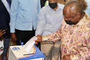 President Cyril Ramaphosa votes at Hitekani Primary School at Chiawelo, Soweto, November 1 2021. 