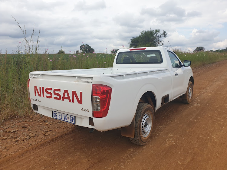 Look ma, no rear bumper, but there is a convenient step built into the side to ease access to the load bay. Picture: DENIS DROPPA