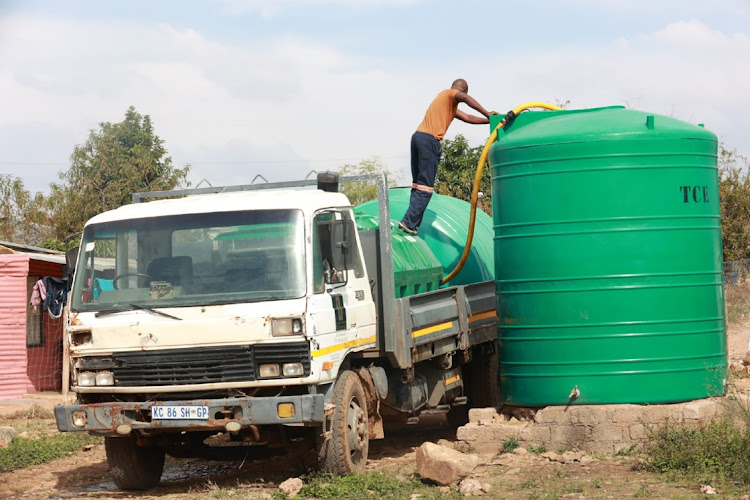 A water tanker refills a communal water tank in Hammanskraal's Chris Hani Ext 3. People of Hammanskraal have, for years, been relying on water from privately-owned water tankers hired by the city to deliver water daily.