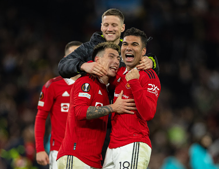 Manchester United's players celebrate during a Uefa Europa League play-off second leg match against Barcelona on February 23