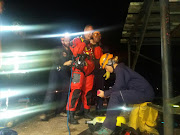 Rescue workers at the scene where a six-year-old boy fell into an unused water tank in KZN.