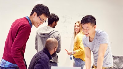 A group of colleagues sharing a joke.