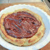 Thumbnail For Melted Chocolate Spread Over Eclair Crust.