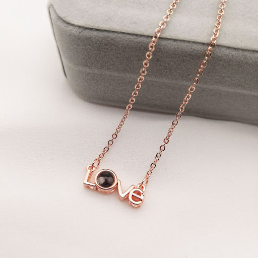 Title 6, LOVE projection necklace